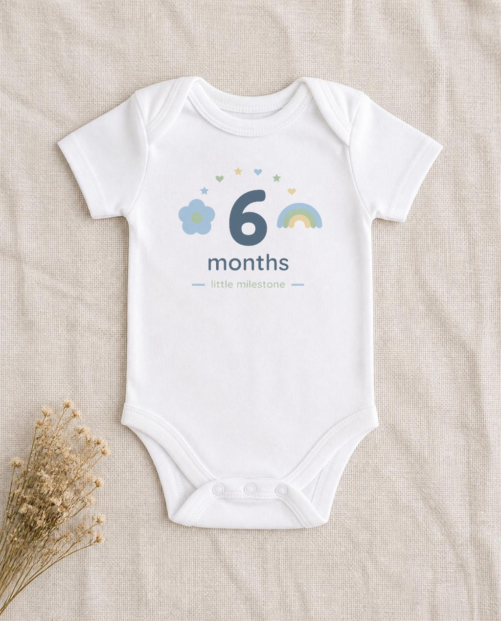 6 months design pressed on a white baby bodysuit