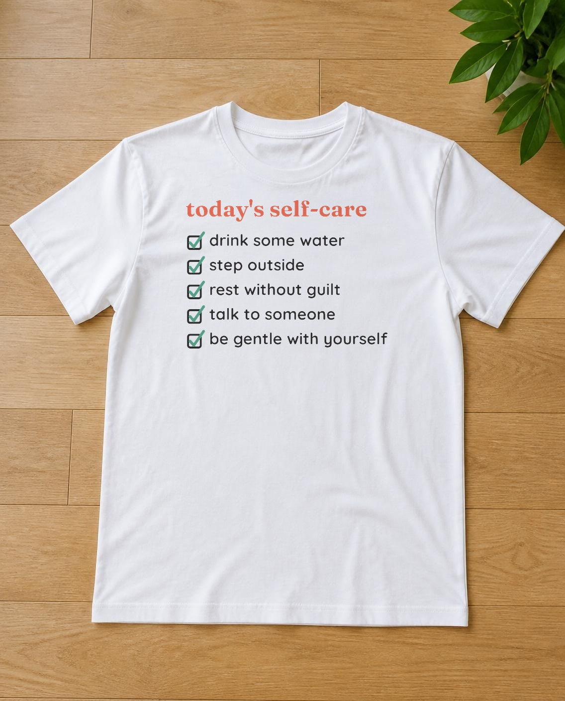 Self-care checklist design on a white tee