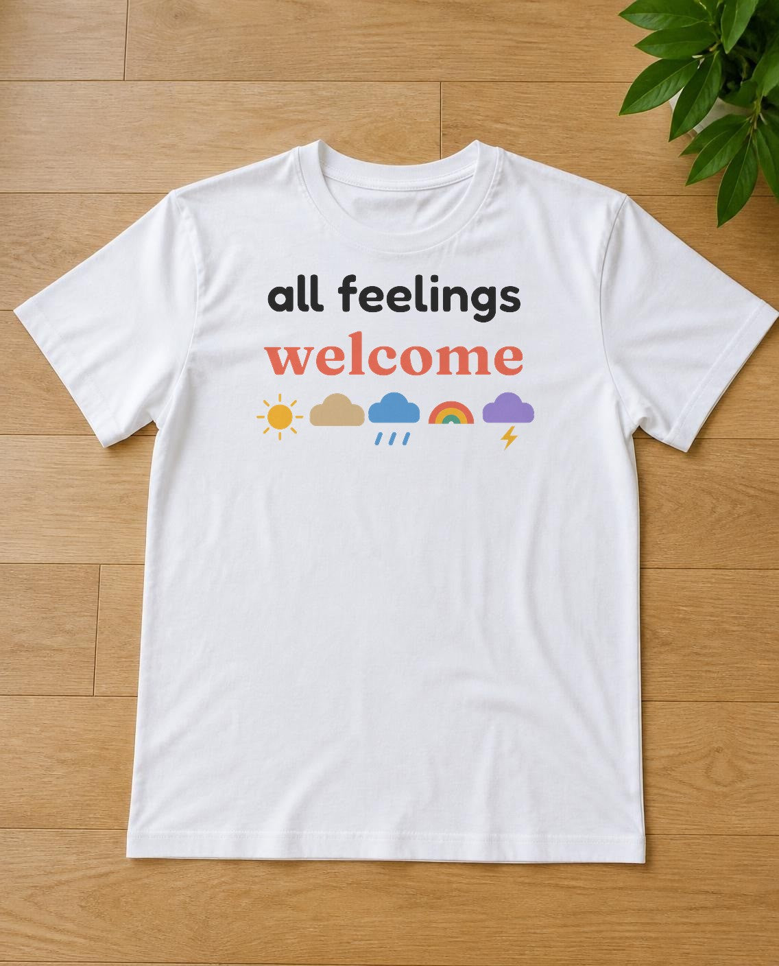 All feelings welcome design on a white tee