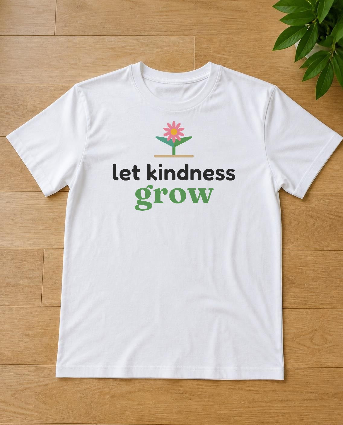 Let kindness grow design on a white tee